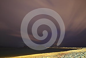 View of lightning strike over a rural farm field, lightning strikes the ground,