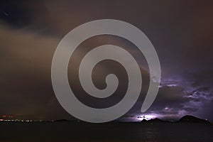 View of lightning strike over a rural farm field, lightning strikes the ground,