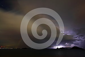 View of lightning strike over a rural farm field, lightning strikes the ground,