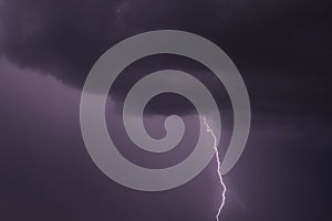 View on lightning striking from rain cloud