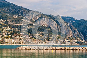 View of Ligurian Alps and Menton city from the Mediterranean Sea