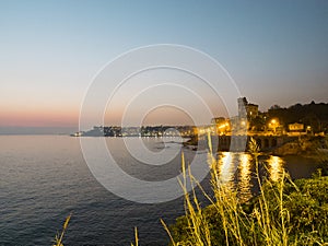 View of the Ligurian sea, calm and at night, Quarto dei Mille area, one of the most beautiful places in Liguria