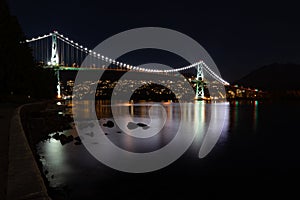 View of Lions Gate Bridge in Vancouver Canada at night from Stanley Park