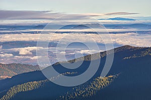 View of Liptovska Mara dam under inversion clouds from Low Tatras mountains