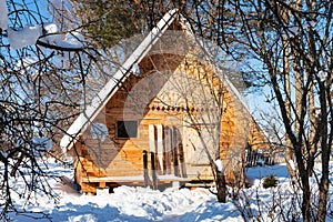 View of little timber chalet and wide skis photo