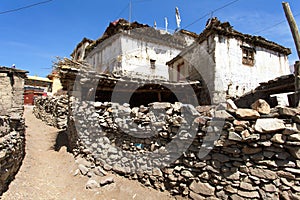 View of local stony building and wall in Jharkot village