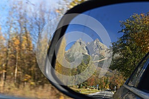 View of Lomnicky Stit in car wing mirror Slovakia
