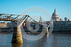 A view of London Millenium Bridge and St Paul`s Cathedral from Bankside in South Bank of Thames River