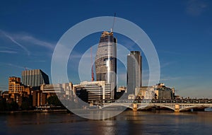 The view of London`s city hall and modern skyscrapers .