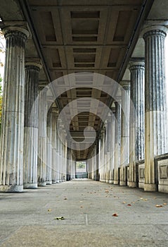 View of the long alley of a historical building with columns