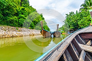 View from long tailed boat in Krabi town, Thailand. Boats are prepared for passenger to famou Railay beach. Boats are traditional