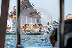 view from long tailed boats, traditional wooden boats on Chao Phraya River. Long tail boat rental Bangkok river service support