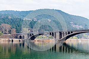 view of Longmen Bridge over Yi River in China photo