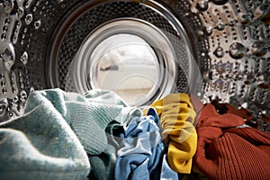 View Looking Out From Inside Washing Machine Filled With Laundry