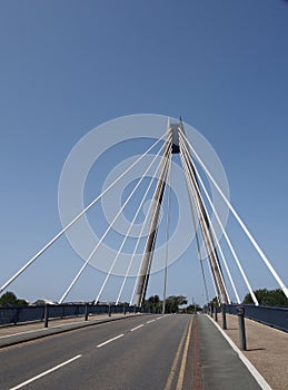 View looking over the suspension bridge in southport merseyside against a blue sky