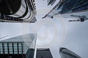 View looking upwards showing the Lloyds of London building designed by Richard Rogers, and the Willis Building by Norman Foster photo