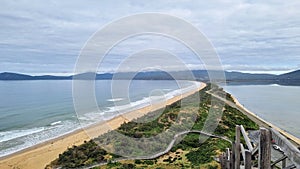 View from the lookout at The Neck Bruny Island over the beach with cloudy skies