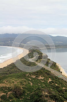 View from the lookout at The Neck Bruny Island over the beach with cloudy skies