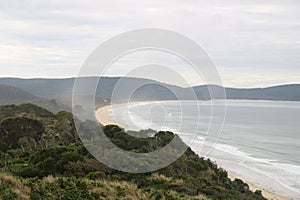 View from the lookout at The Neck Bruny Island over the beach with cloudy skies