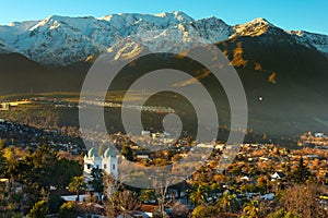View of Los Dominicos neighborhood and Los Dominicos church with Los Andes Mountain Range as a backdrop photo