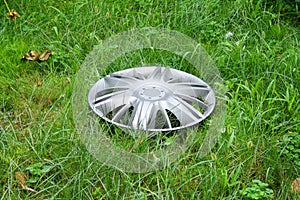 View of lost hubcap on the grass