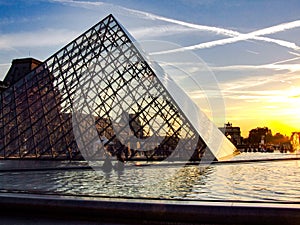 Louvre and glass piramid during sunset