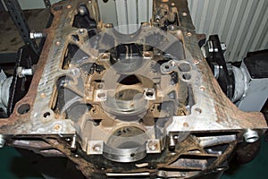 View of the lower part of the old engine cylinder block mounted on the engine repair stand