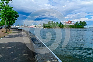 View of the Luoto island, with the promenade, ferry boats, the Russian Orthodox Uspenski Cathedral, and the SkyWheel in Helsinki,