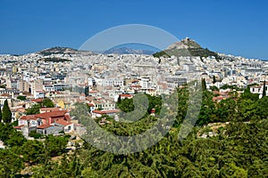 A view of Lykavittos Hill from the Areopagus Hill in Athens, Greece