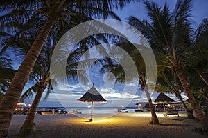 View of Mabul Island in the evening with a bamboo hut