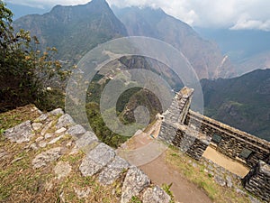 View of Machu Picchu from the top of Waynapicchu mountain, stone walls on ancient Inca construction