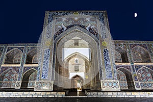 View of Madrasah Nodir Diwan Begi in Bukhara late in the evening,