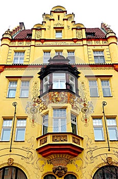 View of a magnificent building facade with a colorful bay window in Old Prague