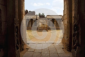 View of the maha-mandapa from the North Gopura of the inner courtyard, an entrance to the Achyuta Raya temple, Hampi, Karnataka