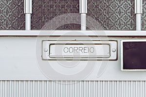 View on mailbox integrated in a metal door. Inscription correio in Portuguese photo