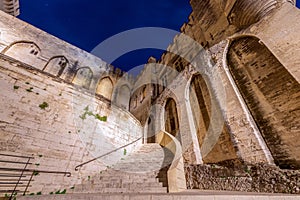 View of main staircase of Palace of the Popes at night in Avignon city