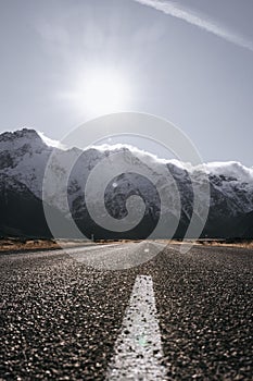 View of the majestic Aoraki Mount Cook with the road leading to Mount Cook Village. Taken during winter in New Zealand.