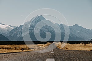 View of the majestic Aoraki Mount Cook with the road leading to Mount Cook Village. Taken during winter in New Zealand.