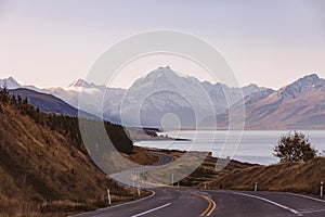 View of the majestic Aoraki Mount Cook with the road leading to Mount Cook Village. Taken during winter in New Zealand.