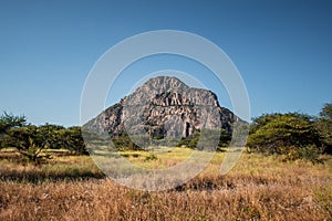 A view of the male hill at Tsodilo Hills, a UNESCO world heritage site featuring ancient San rock paintings. Pictured amid grassy