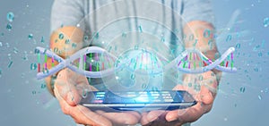 Man holding a 3d rendering data coded Dna with binary file around