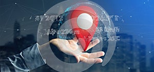 Man holding a 3d rendering pin holder on a globe with coordinate