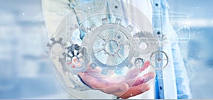 Man holding a technology gear wheel interface3d rendering