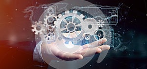 Man holding a technology gear wheel interface3d rendering
