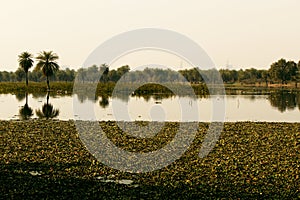 A view of a man made lake Clouds.