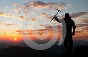 View of man on mountains with ice axe in hand