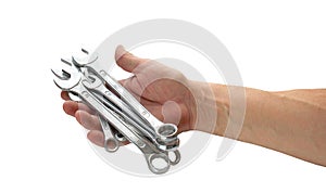 View of a man`s hand holding combination wrench isolated on white background.