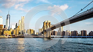 The view of Manhattan skyline and Brookyn bridge from Brooklyn side after sunrise , New york city