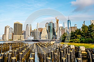 The view of Manhattan skyline and Brookyn bridge from Brooklyn side after sunrise , New york city