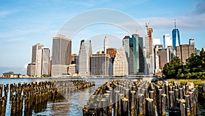 The view of Manhattan skyline and Brookyn bridge from Brooklyn side after sunrise , New york city